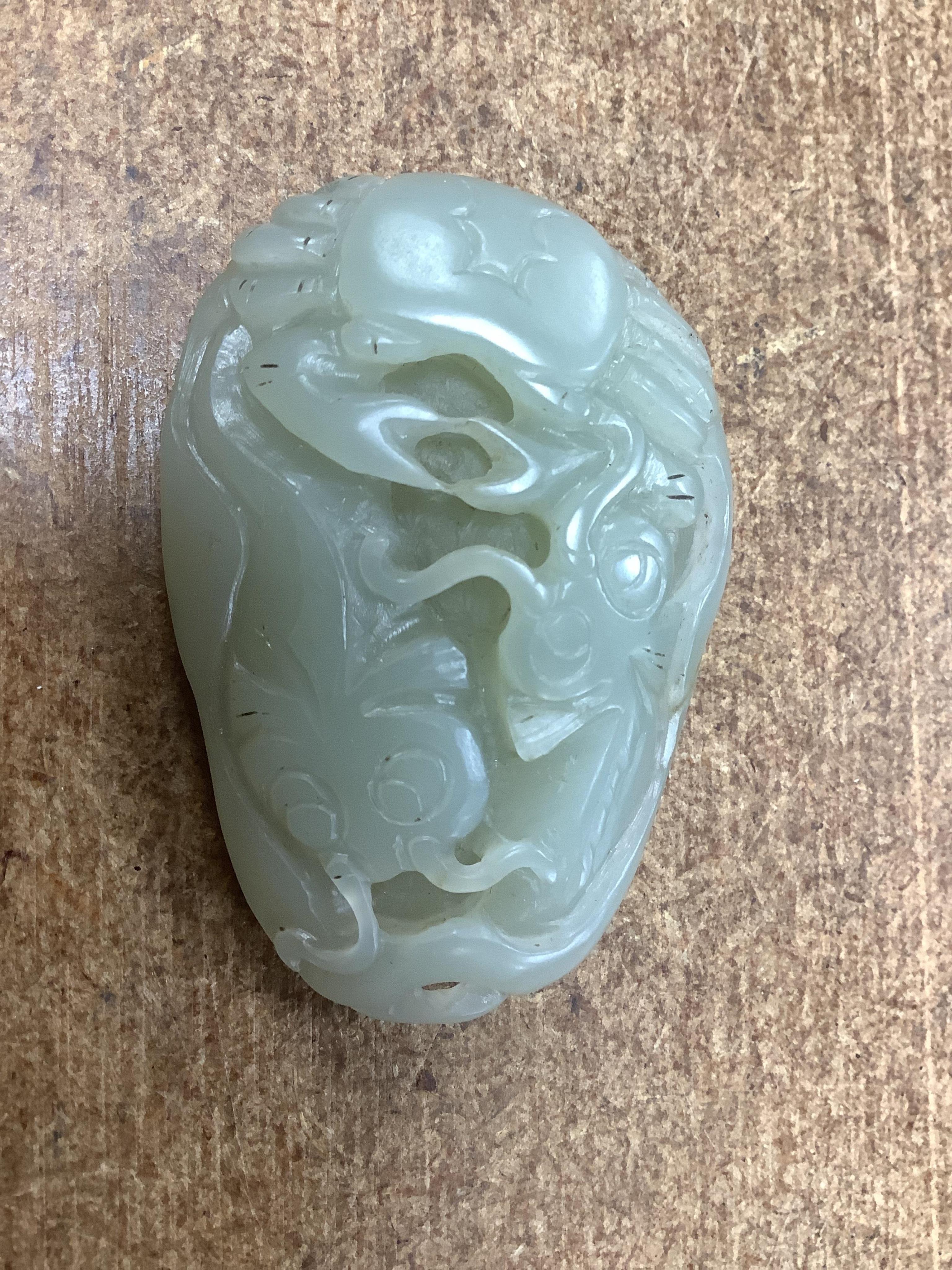 Sixteen Chinese jade and hardstone carvings, including a gilded white metal and jadeite bracelet, three pendants etc. Condition - fair